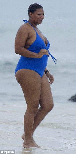 entertainment curvy queen latifah busts out of an