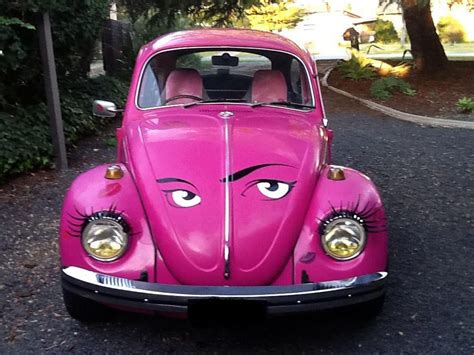 pink vw with eyes on hood volkswagen