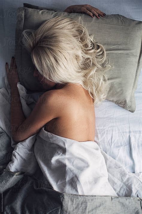 Beautiful Blonde Woman Sleeping In Bed By Lumina