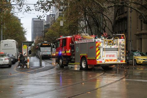 Metropolitan Fire Brigade Truck Tries To Dodge Stopped Trams At The