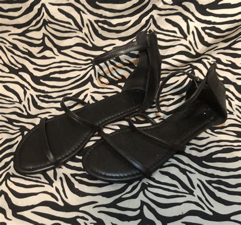 black strappy flats worn  foot babe