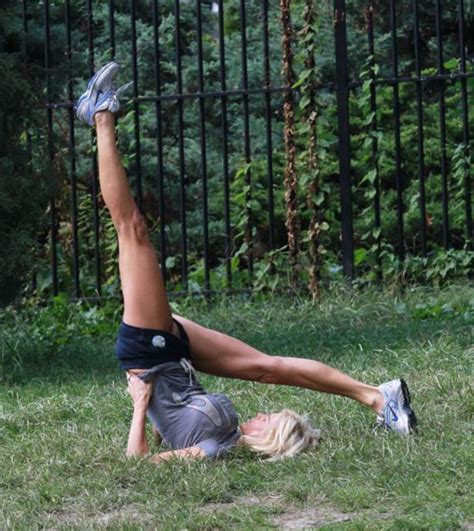 victoria silvstedt stretches in the park