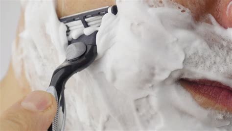 man shaves his heavy stubble stock footage video 17925 shutterstock