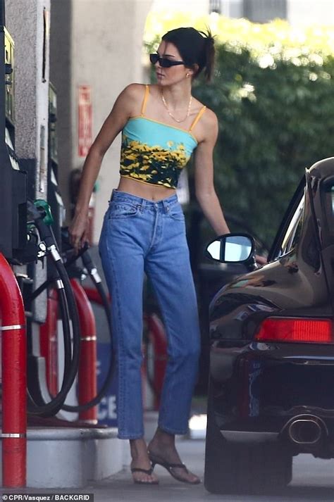 kendall jenner flashes her toned stomach in tank top as
