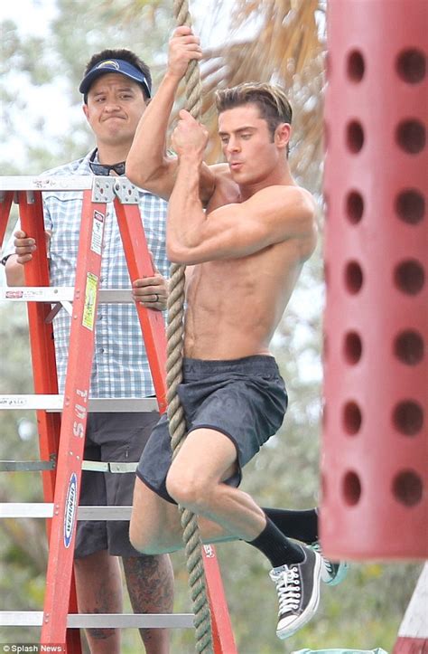 Zac Efron Flexes His Incredible Muscles As He Goes