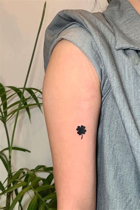 small  leaf clover tattoo   left arm