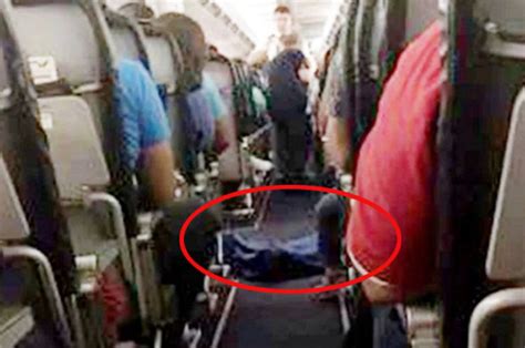 plane travel dead woman corpse laid out aisle daily star