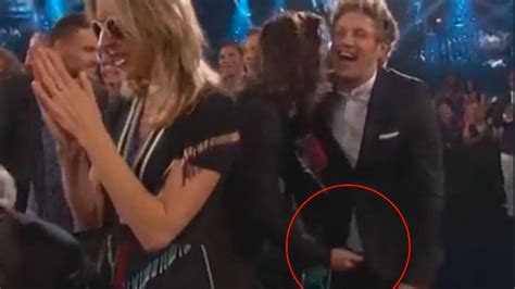 harry styles grabs niall horan s penis as one direction win big at billboard music awards