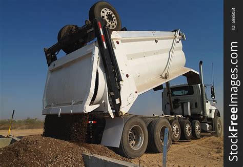 dump truck dumping dirt horizontal  stock images