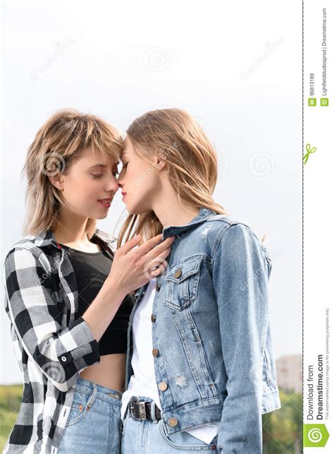 lesbian couple kissing with eyes closed outdoors stock image image of
