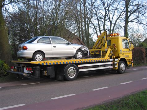Tow Truck With Car Commercial Vehicle Dealer