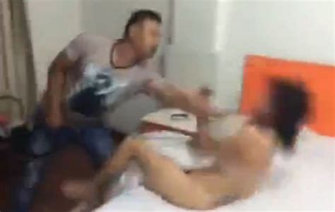video shows husband beating his wife and attacking her lover after catching them in bed together