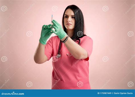 Beautiful Woman Doctor With Stethoscope Wearing Pink Scrubs With