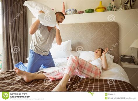 cute couple having a pillow fight stock image image of