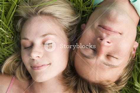 Couple Lying In Grass Sleeping Royalty Free Stock Image Storyblocks