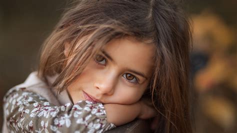cute brown eyes girl  leaning  wooden  blur background hd