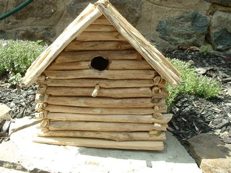 log cabin birdhouse  attract wildlife   garden
