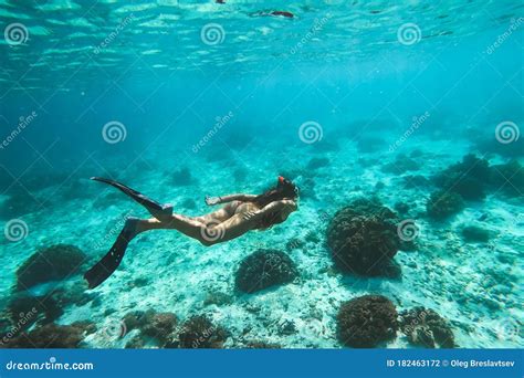 woman snorkel underwater  beautiful tropical lagoon  coral reef stock photo image