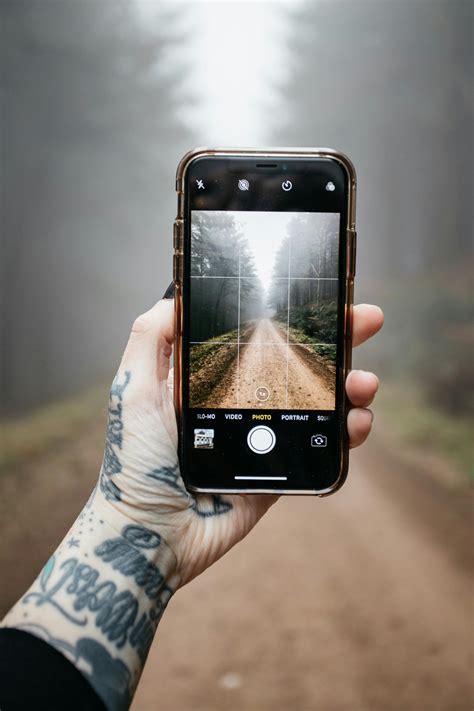 photo  person holding mobile phone  stock photo