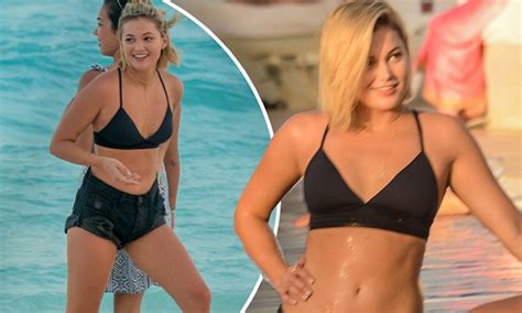 olivia holt flaunts her flat stomach in black bikini daily mail online