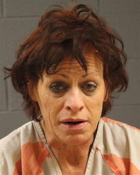 police arrest 48 year old woman for allegedly burglarizing inmates