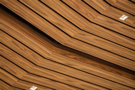 hok  customized metal ceiling elements  wood finishes  create