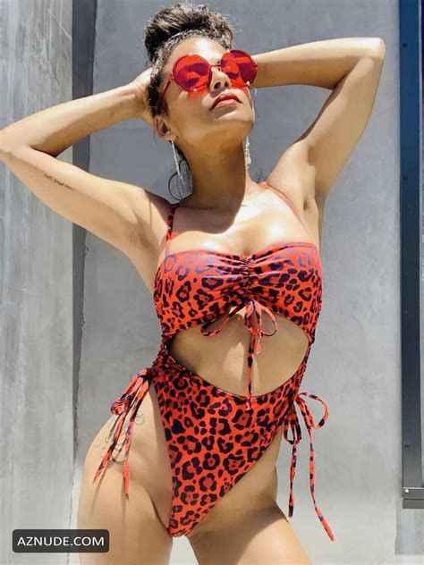 christina milian shares some sexy pics and videos posing in a leopard
