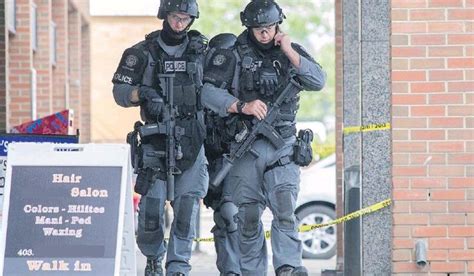 police tactical officers patrol  business complex  southeast calgary   person