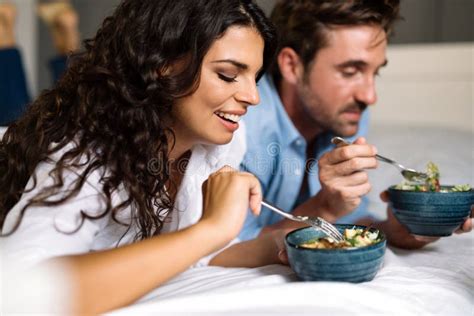 portrait of happy couple enjoying sensual moments together with food