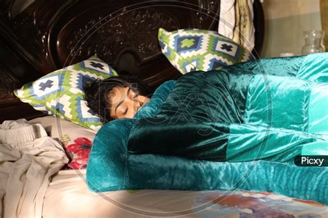 Image Of Young Indian Girl Sleeping On Bed Os584044 Picxy