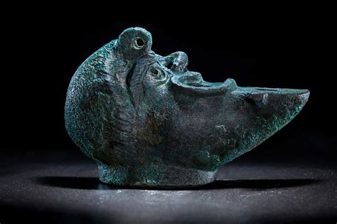 2 000 year old oil lamp shaped like a grotesque face is discovered in