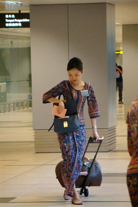 pretty singapore airline stewardess in airport ~ world