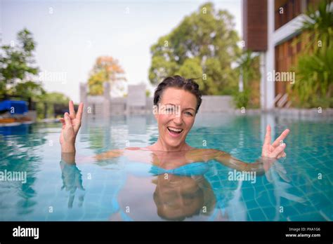 Mature Beautiful Scandinavian Tourist Woman In Swimming Pool Stock