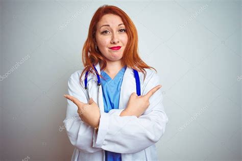 Young Redhead Doctor Woman Using Stethoscope White Isolated Background