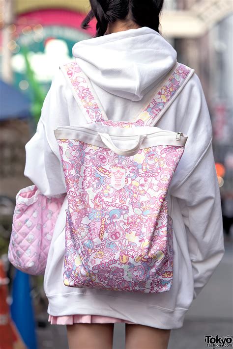 pink bangs oversized hoodie and kawaii fashion on the street in harajuku