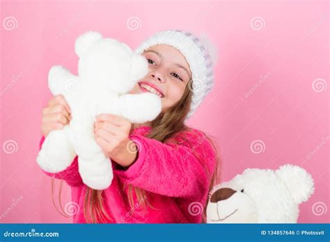 child small girl playful hold teddy bear plush toy  kids love