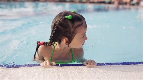 child enjoying swimming pool learning  stock footage sbv