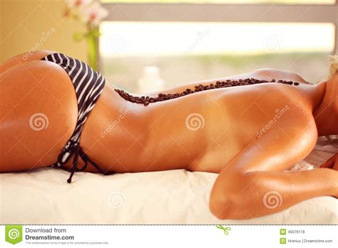 female body in swimming suit at the spa with coffee stock