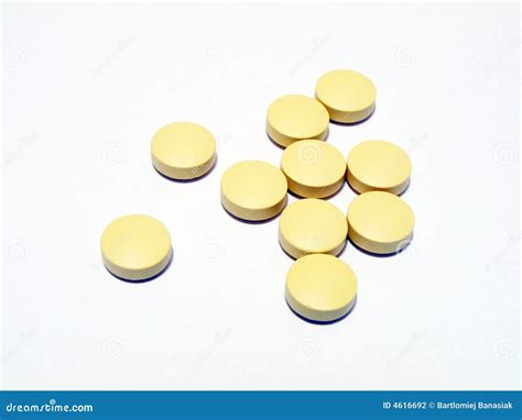 yellow pills stock photography image
