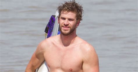 Liam Hemsworth Shirtless While Surfing In Australia Popsugar Celebrity