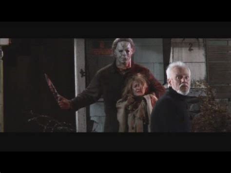 laurie strode being held by michael myers by