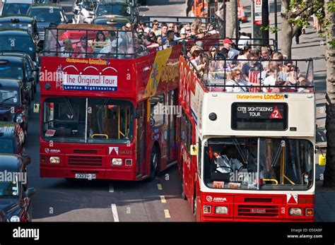 london open top sightseeing tourist buses  summer stock photo alamy
