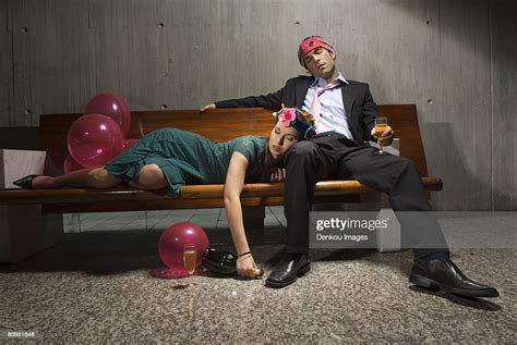 exhausted drunk couple passed out from partying photo getty images