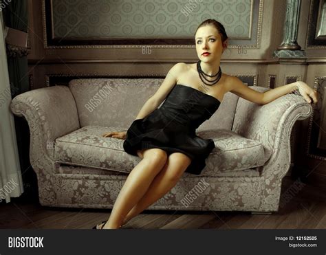 beautiful woman sitting  sofa image photo bigstock