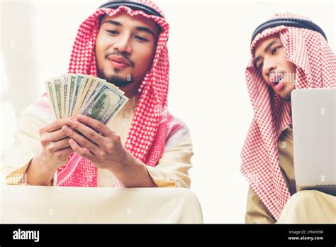 Handsome Greedy Arab Man Showing Money On Hands And Counting Money