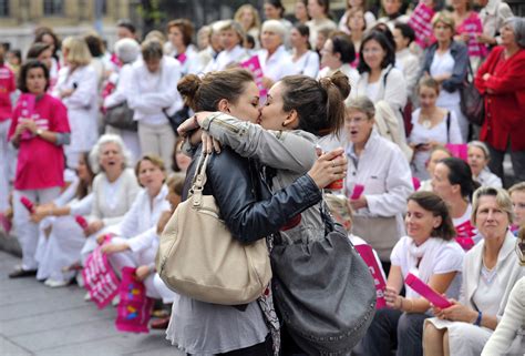 two women kiss in front of anti gay crowd atheism