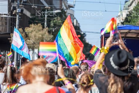 Crowd Raising And Holding Rainbow Gay Flags During A Gay Pride Trans