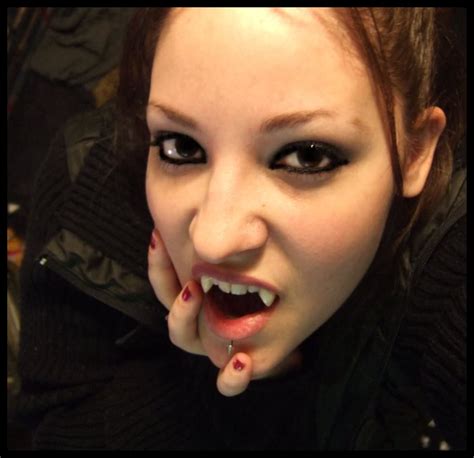 bizarre  weird bizarre female vampire photo fangs