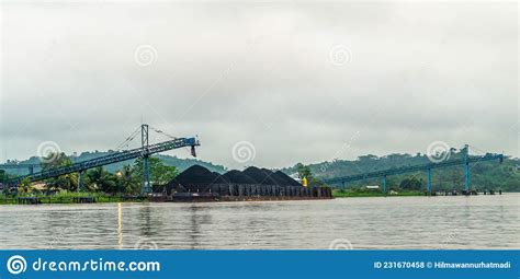 barge  coal loaded  conveyor mahakam river stock photo image  indonesia scenery