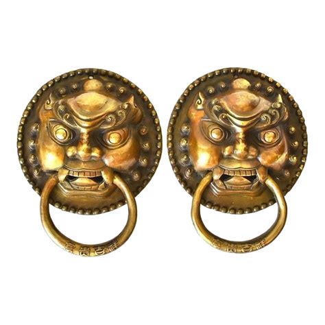 bronze guardians door knockers pair chairish